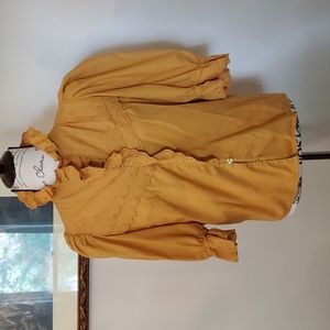 Mustard ruffles and eyelets, puffed shoulder blouse.